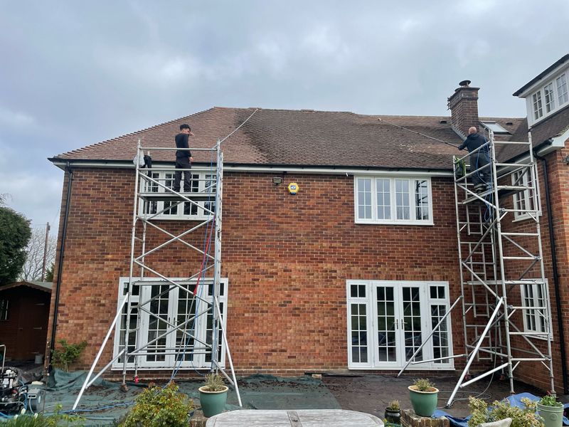 Roof cleaning carried out safely from scaffold towers by The Roof Moss Cleaners in Calne